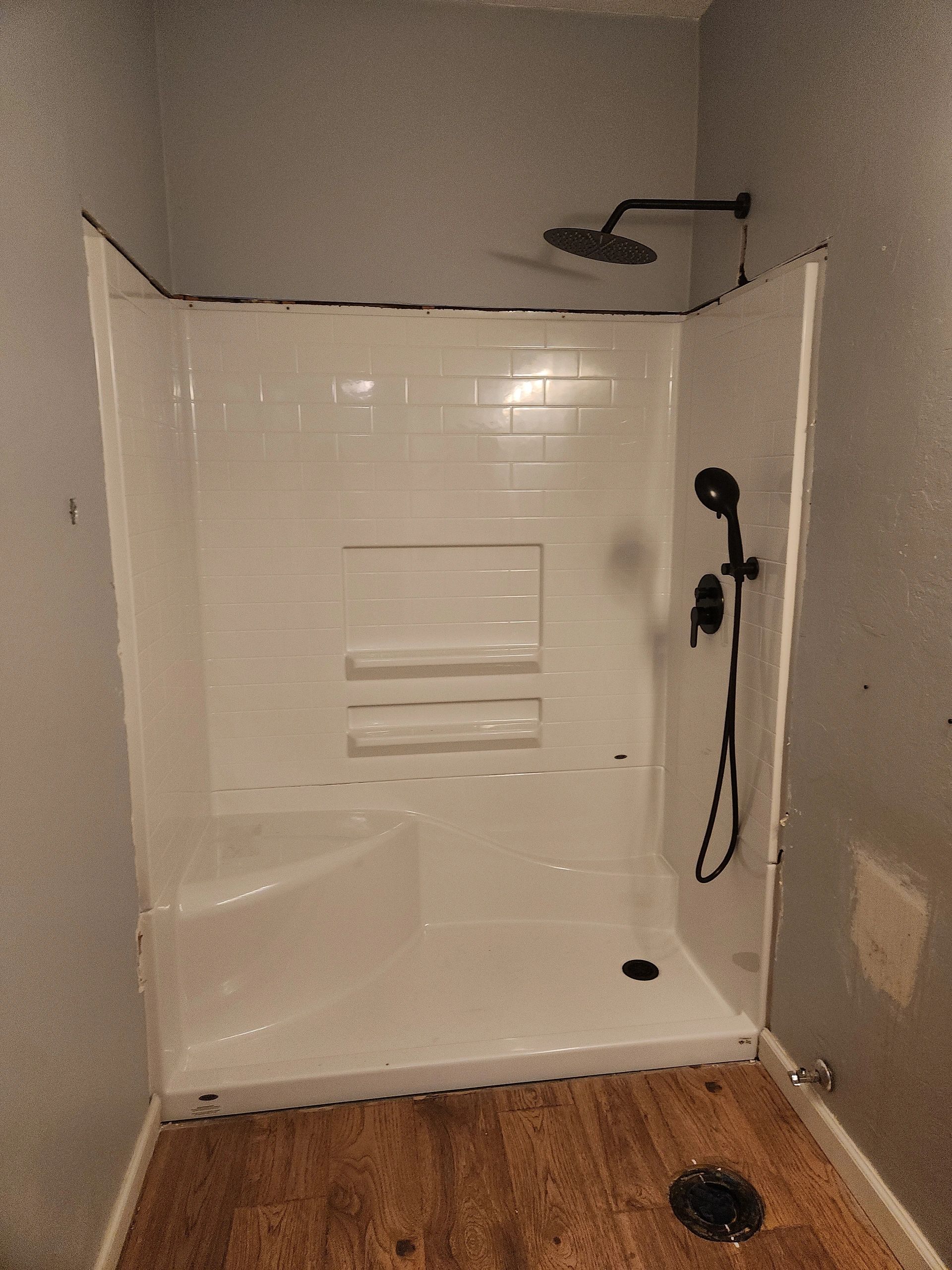 Bathroom shower with white subway tile