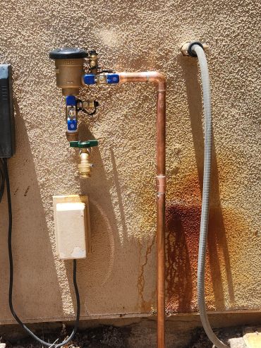 Outdoor copper plumbing pipes and valves